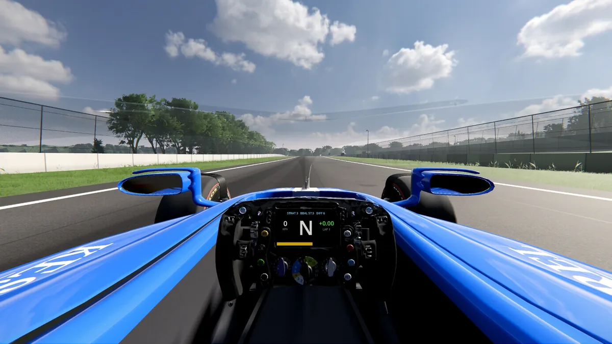 Cockpit view of the modern car: the steering wheel and dash between the front wheels, looking down the track