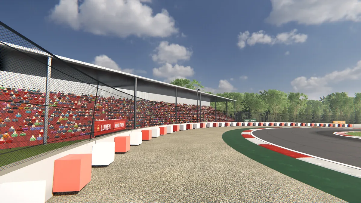 Grandstands full of spectators beside a kerb-lined corner