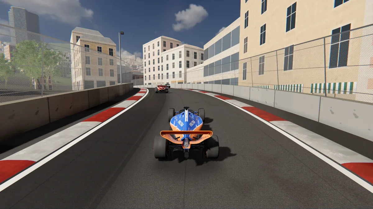 A street circuit between apartment buildings with a car ahead