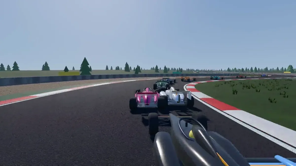 Trailer still: cars racing through a corner on a sunlit circuit